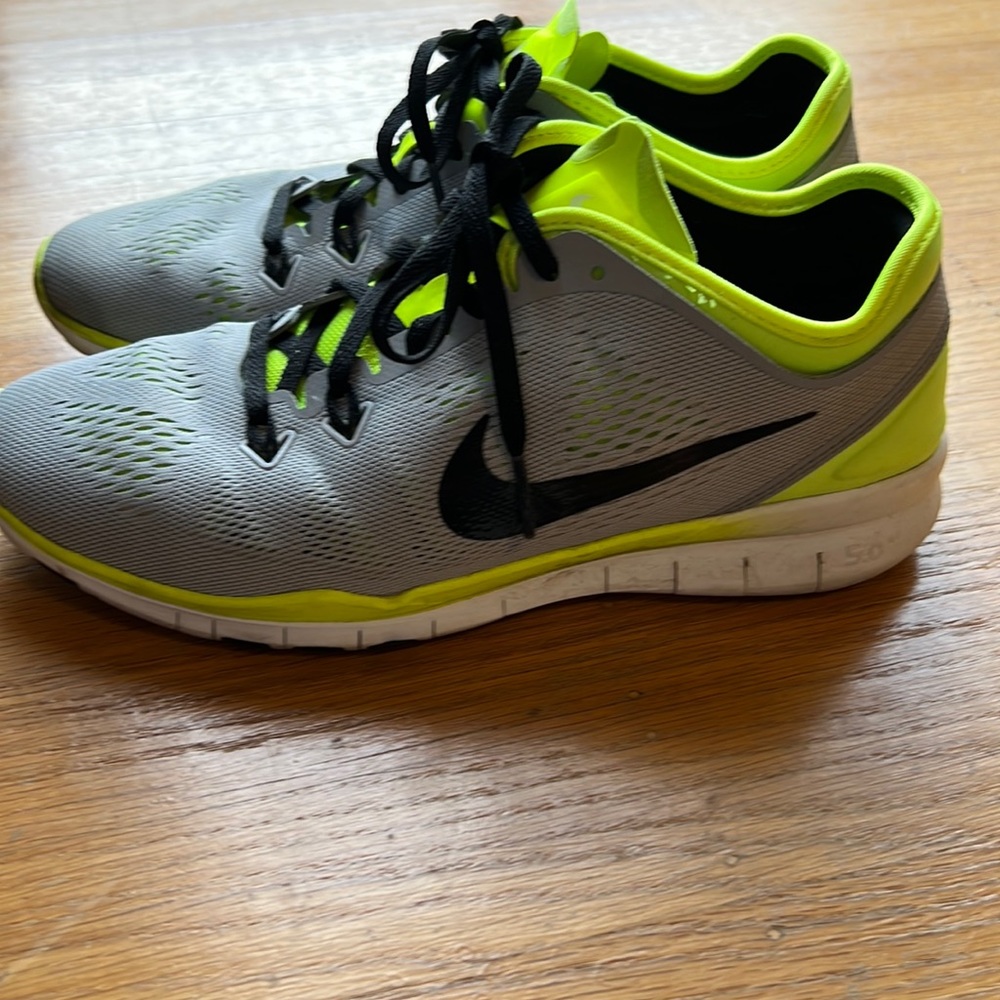 Nike Free. Lightly worn. Women’s size 7.5. Grey and neon yellow